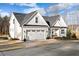 Charming home with a two car garage, landscaped front yard and inviting porch at 955 Lynch Rd, Selma, NC 27576