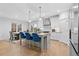 Open kitchen area with stainless steel appliances, kitchen island and breakfast nook at 955 Lynch Rd, Selma, NC 27576