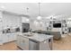Open-concept kitchen featuring granite countertops, stainless steel appliances, and an island for casual dining and meal prep at 955 Lynch Rd, Selma, NC 27576
