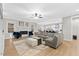 Spacious living room features hardwood floors, fireplace, and a large comfortable sectional couch at 955 Lynch Rd, Selma, NC 27576