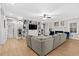 Open living room featuring a custom built-in entertainment center, fireplace and hardwood floors at 955 Lynch Rd, Selma, NC 27576