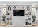 Elegant living room featuring custom built-ins, decorative display, and a sleek entertainment center with decor at 955 Lynch Rd, Selma, NC 27576