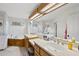 Bright bathroom with double sinks, soaking tub, and separate glass shower at 1 Nicklaus Way, Clayton, NC 27520