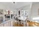 Dining area with a white table, views to the deck and backyard at 1 Nicklaus Way, Clayton, NC 27520