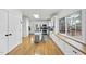 Spacious kitchen with stainless steel appliances, white cabinets, and natural light from a large window at 1 Nicklaus Way, Clayton, NC 27520