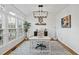 Light-filled office with hardwood floors and bright lighting at 1 Nicklaus Way, Clayton, NC 27520