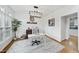 Inviting office with hardwood floors, stylish lighting, and a large window at 1 Nicklaus Way, Clayton, NC 27520