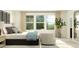Bright bedroom featuring large windows, comfortable chairs, and a cozy bed with stylish decor at 10068 Regal Dr, Angier, NC 27501