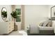 Well-lit bedroom featuring a bed and a large plant and dresser by the window at 10068 Regal Dr, Angier, NC 27501