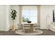 Well-lit dining area featuring a round table, modern chairs, and stylish décor at 10068 Regal Dr, Angier, NC 27501