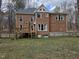Spacious backyard showcasing a well-kept lawn and a wooden deck, perfect for outdoor entertaining at 1025 Shellrock Dr Dr, Wake Forest, NC 27587