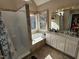 Bright bathroom featuring a separate shower and soaking tub by a large window at 1025 Shellrock Dr Dr, Wake Forest, NC 27587