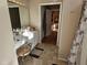Bathroom with a modern vanity, a shower with tile surround, and a large mirror at 1025 Shellrock Dr Dr, Wake Forest, NC 27587