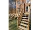 Wooden deck stairs offer access to the backyard at 1025 Shellrock Dr Dr, Wake Forest, NC 27587