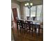 Charming dining room featuring a dark wood table, neutral walls, and hardwood flooring at 1025 Shellrock Dr Dr, Wake Forest, NC 27587