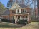 Beautiful brick home featuring a welcoming front porch and well-maintained landscaping at 1025 Shellrock Dr Dr, Wake Forest, NC 27587