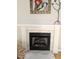 Elegant fireplace with white mantle and marble surround, complemented by decorative accents at 1025 Shellrock Dr Dr, Wake Forest, NC 27587