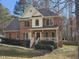 Charming two-story brick home with a welcoming front porch and landscaped yard at 1025 Shellrock Dr Dr, Wake Forest, NC 27587
