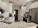 Bright kitchen features granite countertops, stainless steel appliances, and white cabinetry at 1025 Shellrock Dr Dr, Wake Forest, NC 27587