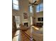 Bright living room featuring a fireplace, hardwood floors, and an abundance of natural light at 1025 Shellrock Dr Dr, Wake Forest, NC 27587