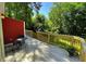 Back deck with red siding and a table and chairs at 105 Johnson St, Chapel Hill, NC 27516