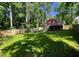 Back yard with grass and a deck overlooking the yard at 105 Johnson St, Chapel Hill, NC 27516