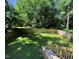 Green back yard with a wood fence and stairs going down to the yard at 105 Johnson St, Chapel Hill, NC 27516