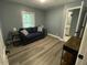 Bedroom with hardwood floors and view of the en suite bathroom at 105 Johnson St, Chapel Hill, NC 27516