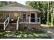 Charming brick home featuring a cozy front porch and well-manicured lawn at 105 Johnson St, Chapel Hill, NC 27516