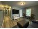 Comfortable living room with hardwood floors, modern lighting, and plenty of natural light at 105 Johnson St, Chapel Hill, NC 27516