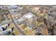 Aerial view of a neighborhood featuring a mix of residential and commercial properties on a sunny day at 1127 W Webb Ave, Burlington, NC 27217