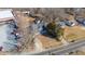 A high-angle view showcasing a house situated alongside a business, illustrating mixed-use development at 1127 W Webb Ave, Burlington, NC 27217