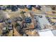 An aerial photo showcasing a neighborhood with houses and some commercial buildings, all surrounded by bare trees at 1127 W Webb Ave, Burlington, NC 27217