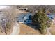 Overhead view of a house with a white porch, illustrating a neighborhood close to a commercial area at 1127 W Webb Ave, Burlington, NC 27217
