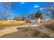 Large, empty backyard with fence, storage shed, and gravel at 1127 W Webb Ave, Burlington, NC 27217