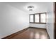 A bright, simply styled room with natural wood flooring at 1127 W Webb Ave, Burlington, NC 27217