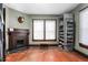 Charming bedroom with a vintage fireplace and large windows at 1127 W Webb Ave, Burlington, NC 27217