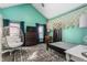 Light and airy bedroom with egg chair, colorful rug, and bed with macrame canopy at 1127 W Webb Ave, Burlington, NC 27217