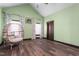 Comfortable bedroom with chair, curtains and a vaulted ceiling at 1127 W Webb Ave, Burlington, NC 27217