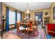 Dining room featuring a wooden table, chandelier lighting, and blue drapes at 1127 W Webb Ave, Burlington, NC 27217