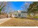 Inviting home featuring a classic design with a covered porch, manicured lawn, and a welcoming entrance at 1127 W Webb Ave, Burlington, NC 27217