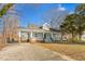 Charming home featuring a spacious front porch, inviting entrance and well maintained landscape at 1127 W Webb Ave, Burlington, NC 27217