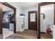 Hallway with wood floors, connects the kitchen, half bath, and the front door entrance at 1127 W Webb Ave, Burlington, NC 27217