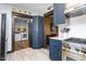 View of the kitchen leading to the laundry room with modern appliances and white walls at 1127 W Webb Ave, Burlington, NC 27217