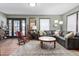 Warm living room with wooden floors, comfortable seating, decorative touches and natural lighting at 1127 W Webb Ave, Burlington, NC 27217
