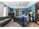 Beautifully decorated main bedroom with a fireplace, tray ceilings, and blue walls at 1127 W Webb Ave, Burlington, NC 27217