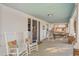 Cozy porch featuring rocking chairs with decorative pillows, and an inviting space at 1127 W Webb Ave, Burlington, NC 27217