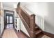 Stairway with stained wood railings and natural fiber mat at 1127 W Webb Ave, Burlington, NC 27217