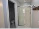 Modern bathroom features a glass-enclosed shower and a toilet, perfect for a sleek design at 113 Hawkscrest Ct, Apex, NC 27502