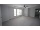 Generously sized bedroom with a trey ceiling, large windows, and neutral carpeting at 113 Hawkscrest Ct, Apex, NC 27502